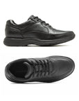 Top and side view of black leather lace up shoe. Rockport logo showing in heel.
