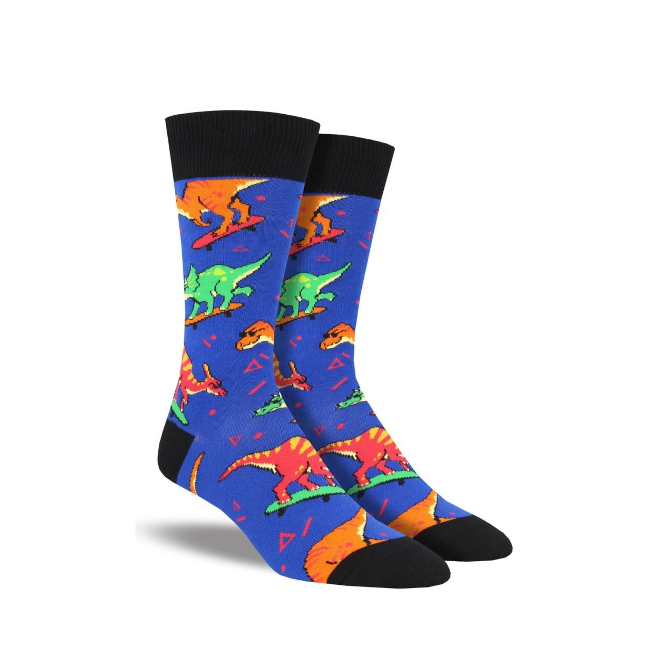 Blue socks with skateboarding dinosaurs on it