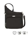 Black crossbody bag with horizontal zippered pocket and zippered pouch pocket. Silver Travelon logo emblem on front.