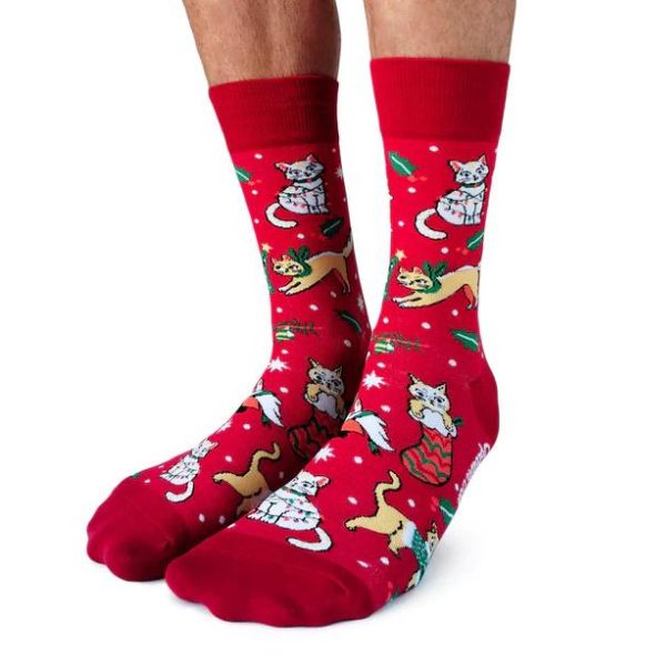 Red socks featuring cats in presents and stockings. Called feline festive.