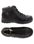 Top and side view has warm lining on  Black lace up ankle boot by Rieker with knit trim and black circle accent on side with dots.