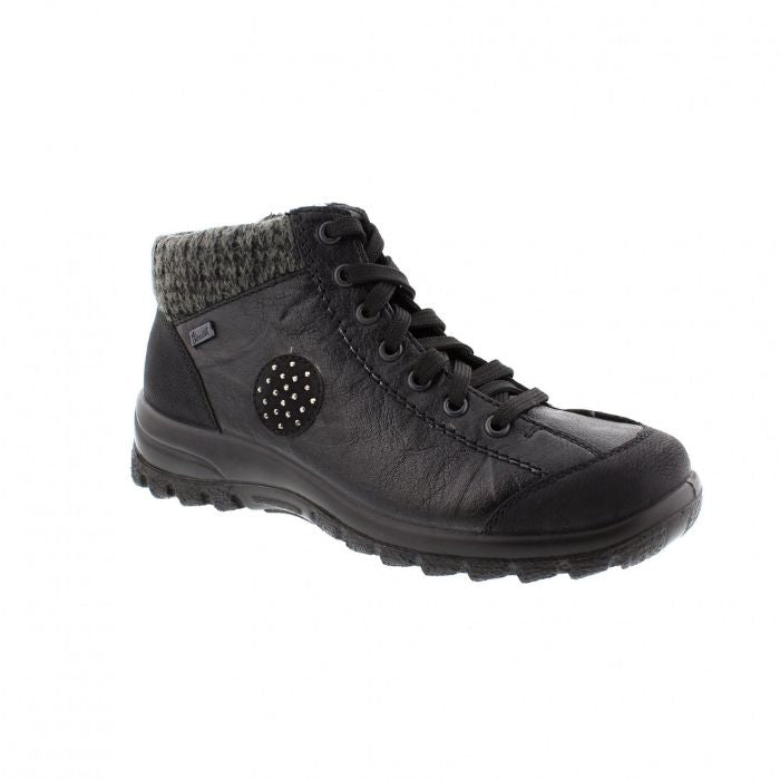 Black lace up ankle boot by Rieker with knit trim and black circle accent on side with dots.